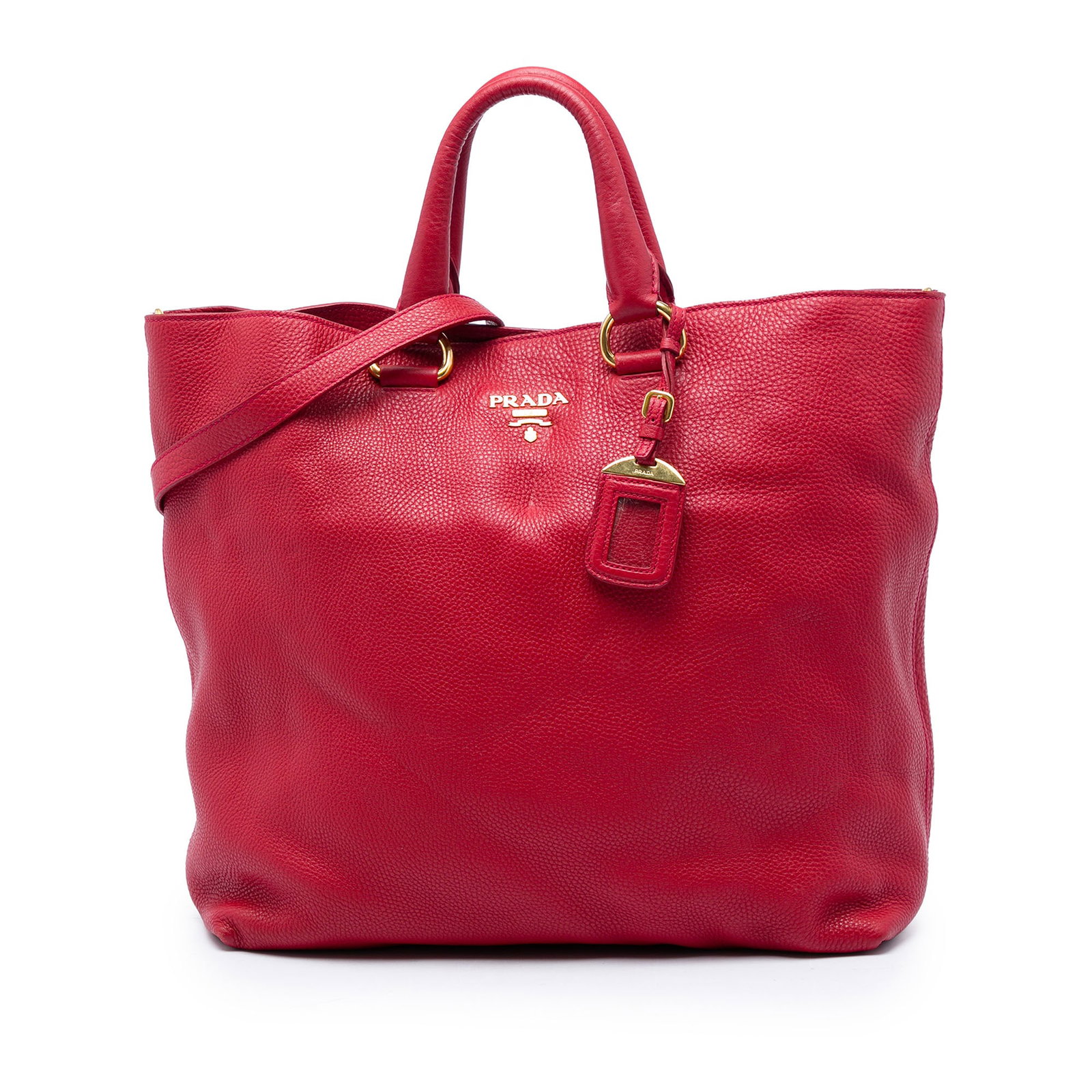 Prada Vitello Daino leather satchel with strap in red: Prada Vitello Daino leather satchel with strap in red A Prada Vitello Daino Open Convertible Tote in red calfskin leather with rolled leather handles and an adjustable, detachable flat strap. The open