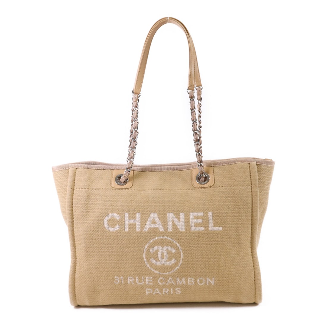 CHANEL Deauville Canvas Shoulder Tote Beige SHW: CHANEL Deauville Canvas Shoulder Tote Beige SHW CHANEL Deauville tote shoulder bag in beige canvas with CC motif and silver-tone hardware. Designed for women, this regular-size bag features a magnetic