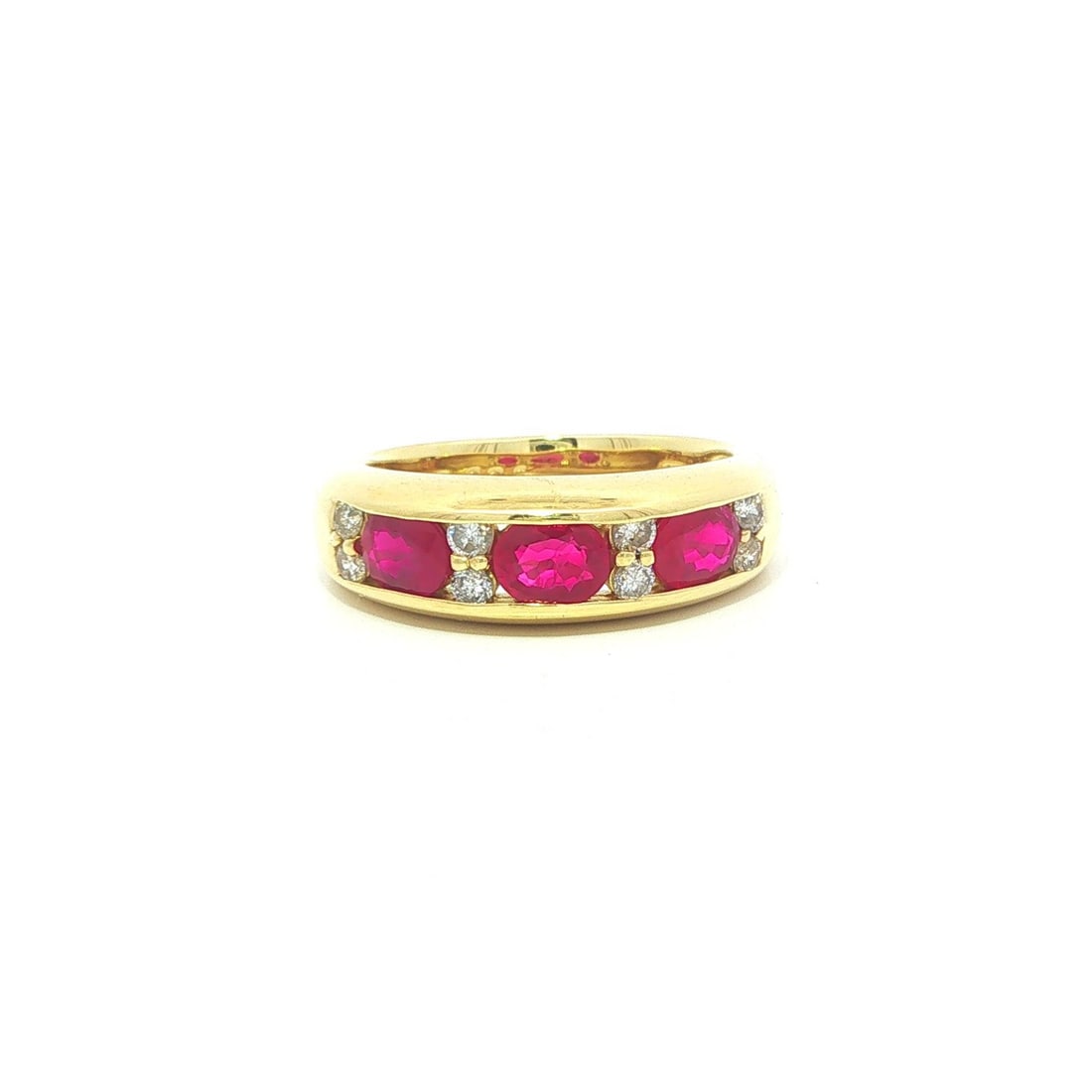 18k Yellow Gold Ruby Diamond East West Band Ring 1.46ctw: 18k Yellow Gold Ruby Diamond East West Band Ring 1.46ctw Pre-owned women's band ring crafted in solid 18k yellow gold and set with three natural oval brilliant-cut rubies in a channel setting, accente