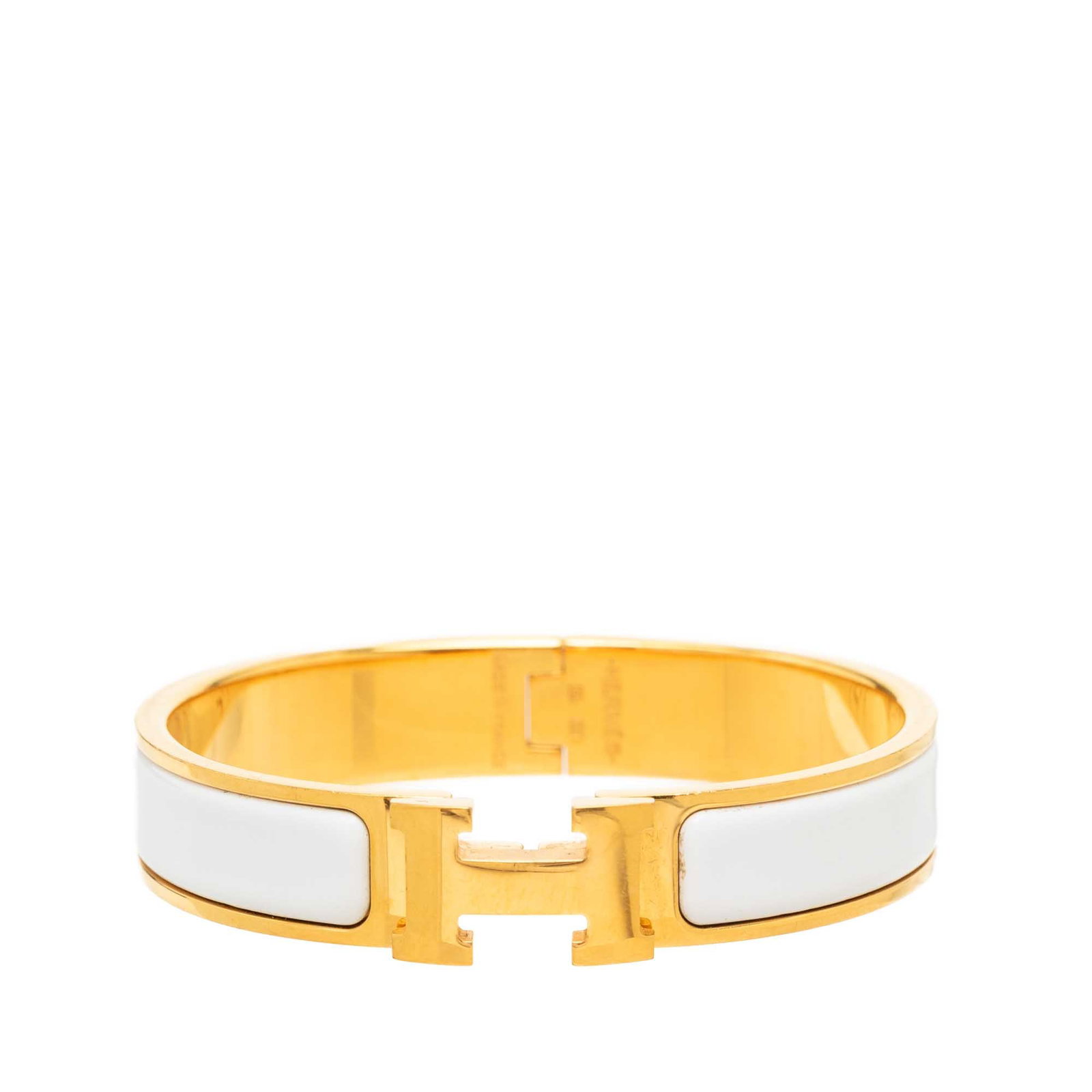 Hermes Clic H PM Narrow Enamel Bracelet White: Hermes Clic H PM Narrow Enamel Bracelet White Hermes Narrow Enamel Clic H Bracelet PM featuring a white enamel body with gold-tone metal accents and the signature H clasp closure. Made in France, this