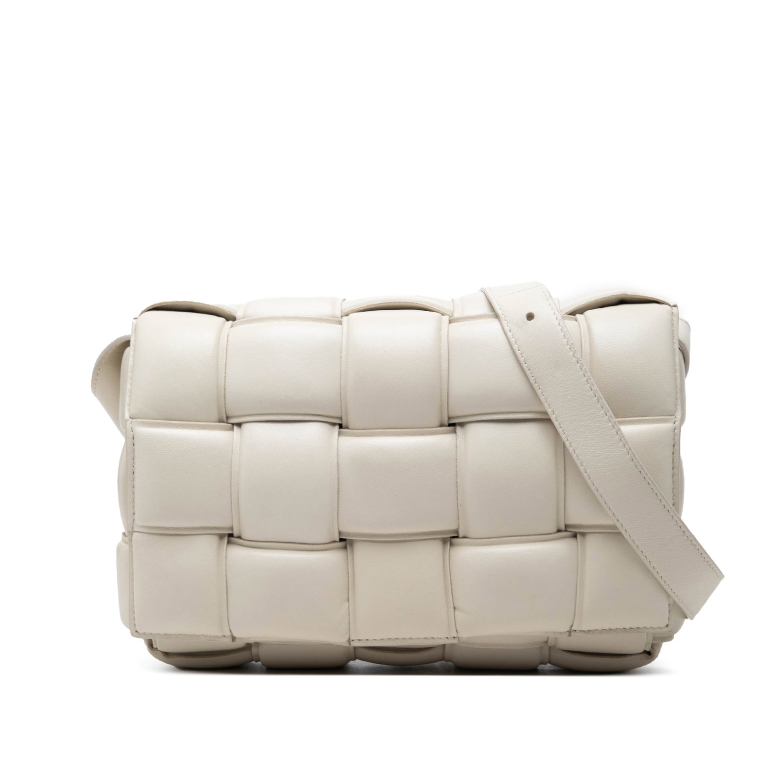 Bottega Veneta Padded Cassette Crossbody in White Nappa Leather: Bottega Veneta Padded Cassette Crossbody in White Nappa Leather A Bottega Veneta Padded Cassette crossbody crafted in woven nappa leather with the signature Intrecciato design. This bag features a fro