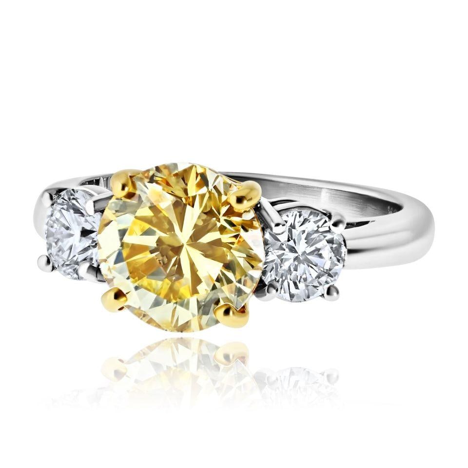 Platinum 18K Yellow Gold 2.45ct Fancy Yellow Diamond Engagement Ring Size 6.5: Platinum 18K Yellow Gold 2.45ct Fancy Yellow Diamond Engagement Ring Size 6.5 Three-stone engagement ring featuring a 2.45 ct fancy yellow round cut diamond accented by two round white diamonds totali