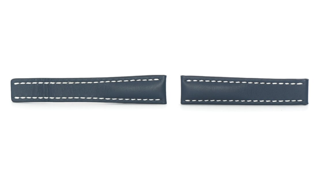Breitling 20mm Blue Leather Wristwatch Band: Breitling 20mm Blue Leather Wristwatch Band Pre-owned Breitling wristwatch band in blue leather, designed for Breitling watches. This men's strap is made in Switzerland and features a tapered profile.