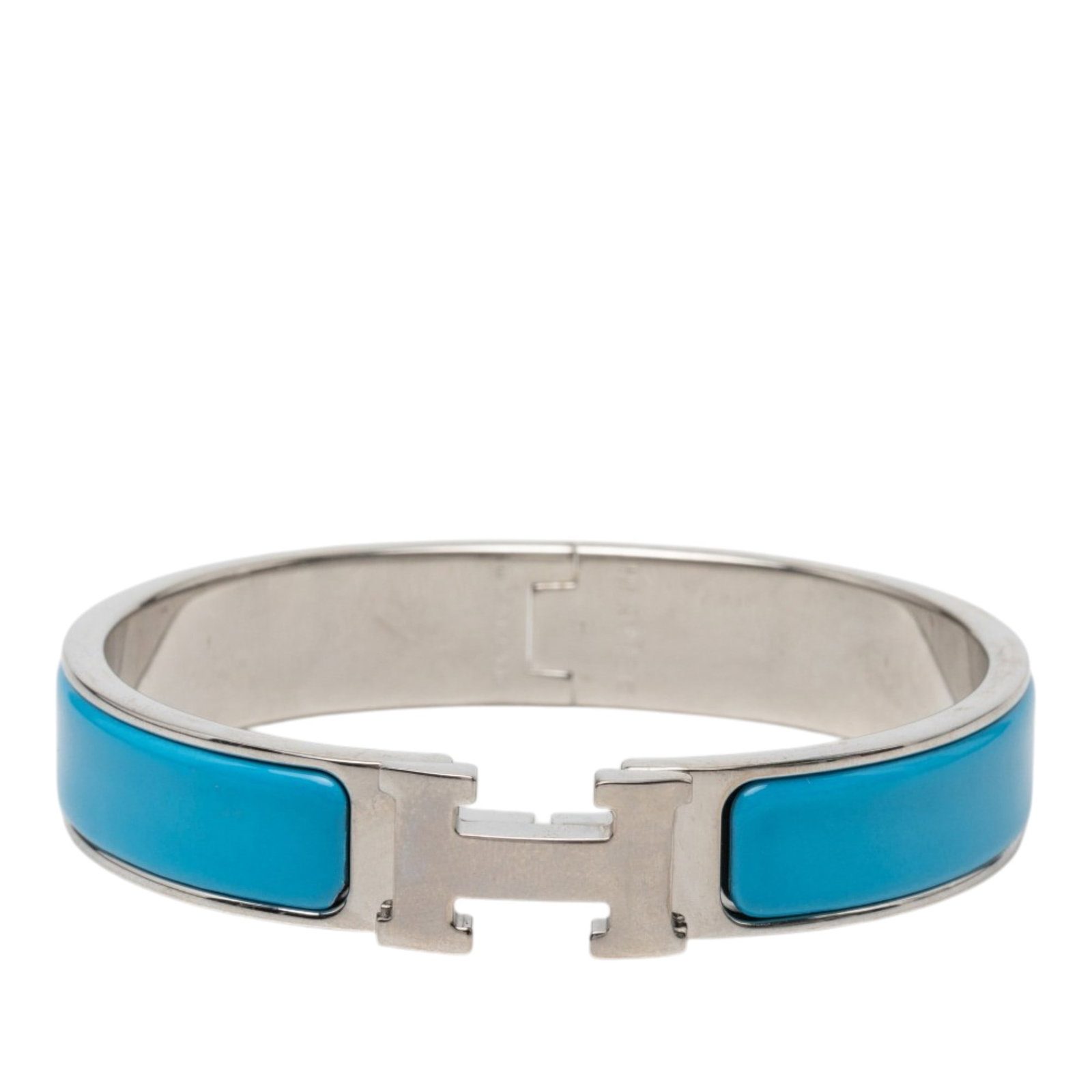 Hermes Clic H PM Narrow Enamel Bracelet Blue: Hermes Clic H PM Narrow Enamel Bracelet Blue Hermes Narrow Enamel Clic H Bracelet PM with an enamel body and palladium-plated metal hardware. This bracelet is made in France and features the signature