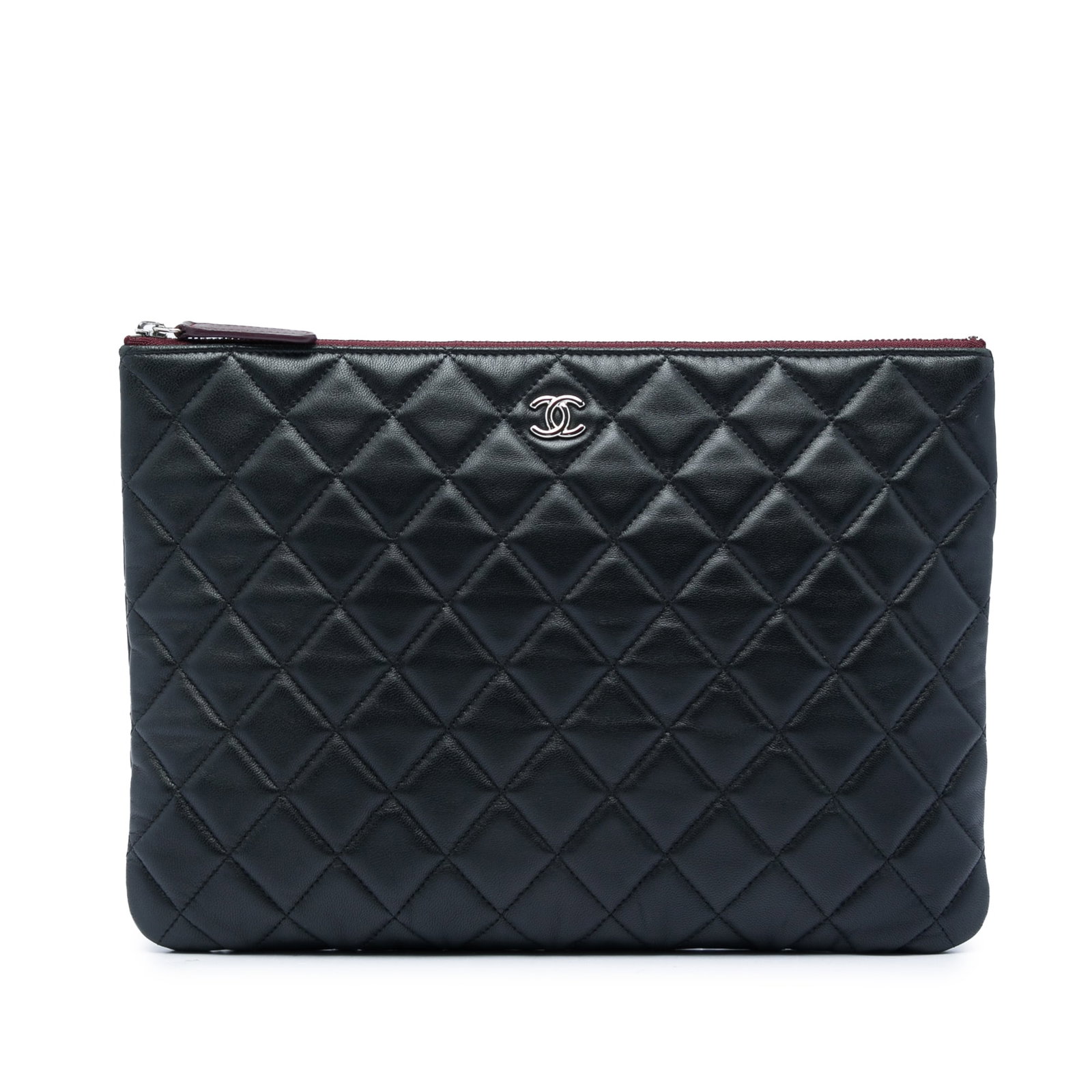 Chanel O Case Medium Quilted Lambskin Clutch Black: Chanel O Case Medium Quilted Lambskin Clutch Black A Chanel Medium Quilted Lambskin O Case Clutch in black leather with a quilted finish. This clutch features a top zip closure and an interior zip poc
