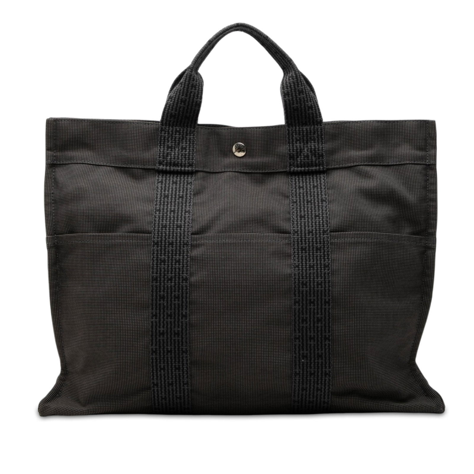 Hermes Herline MM Canvas Tote Bag Gray: Hermes Herline MM Canvas Tote Bag Gray Hermes Herline MM tote bag in gray canvas with a structured everyday design. It features exterior slip pockets on the front and back, flat handles, a top zip clo