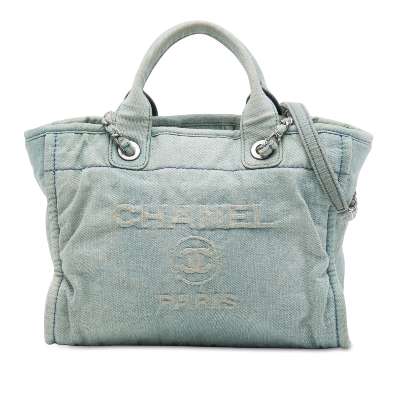 Chanel Deauville Small Blue Denim Tote Bag: Chanel Deauville Small Blue Denim Tote Bag A Chanel Small Denim Deauville Tote in blue fabric with rolled handles, denim-woven chain link shoulder straps, an open top with magnetic snap closure, and i