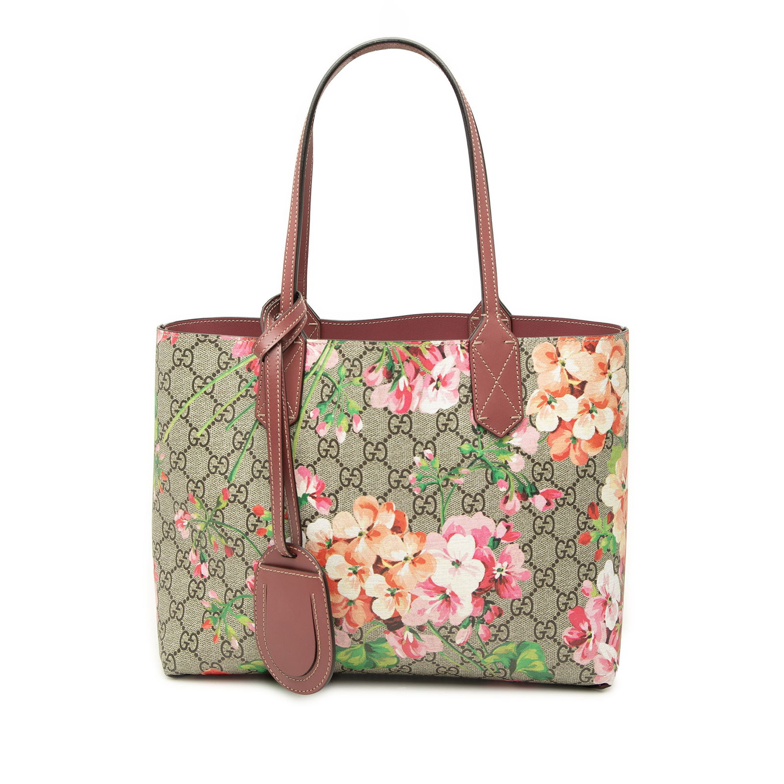 Gucci GG Supreme Blooms Small Reversible Tote Bag: Gucci GG Supreme Blooms Small Reversible Tote Bag Gucci Small GG Supreme Blooms Reversible Tote crafted with a coated canvas body, leather trim, flat leather handles, and an open top. This reversible 