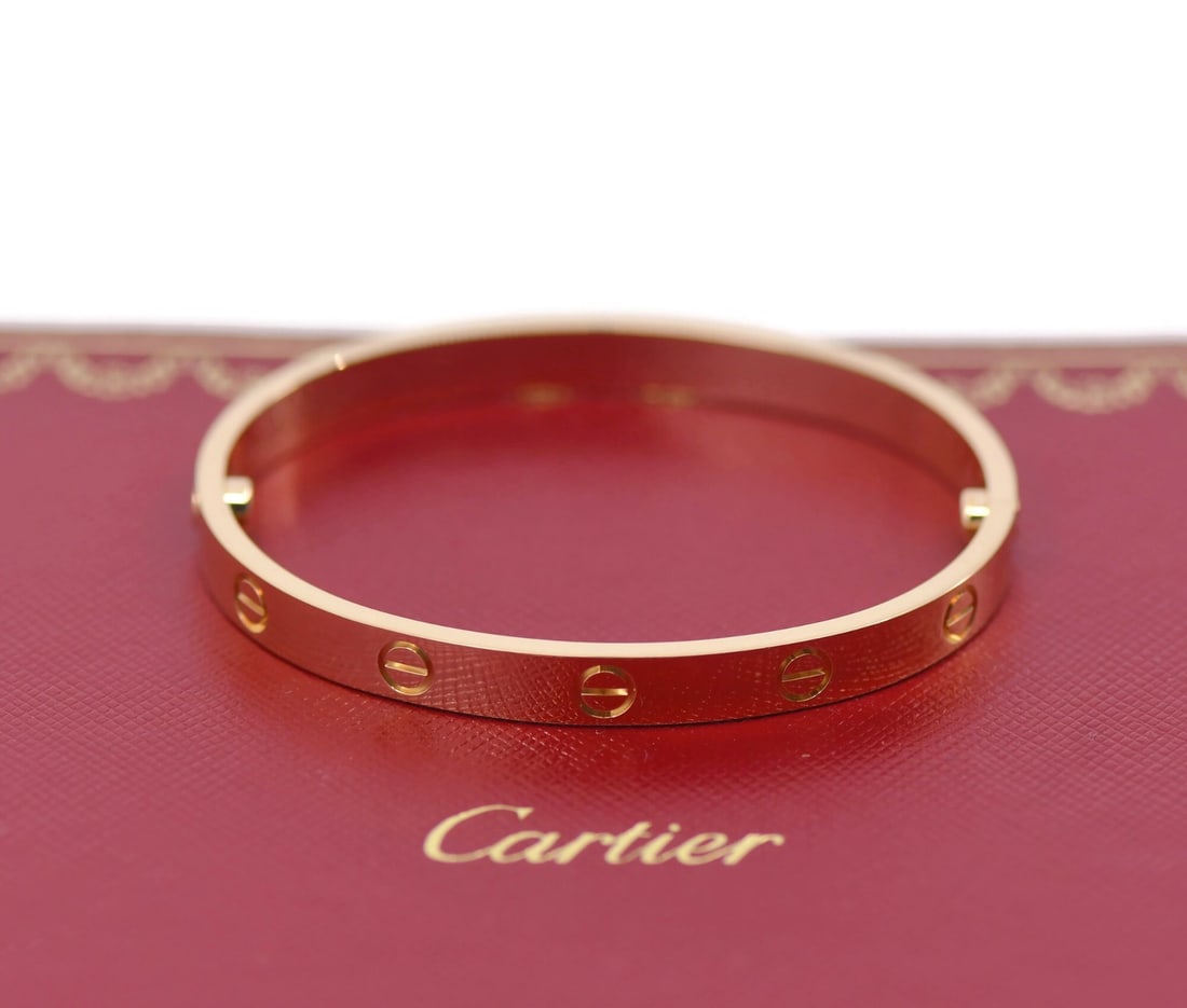 Cartier 18K Rose Gold Love Bangle Bracelet Size 17 Authentic with Box: Cartier 18K Rose Gold Love Bangle Bracelet Size 17 Authentic with Box Adorn yourself with this exquisite Cartier Love Bracelet, crafted in luxurious 18K rose gold. This bangle-style bracelet embodies 