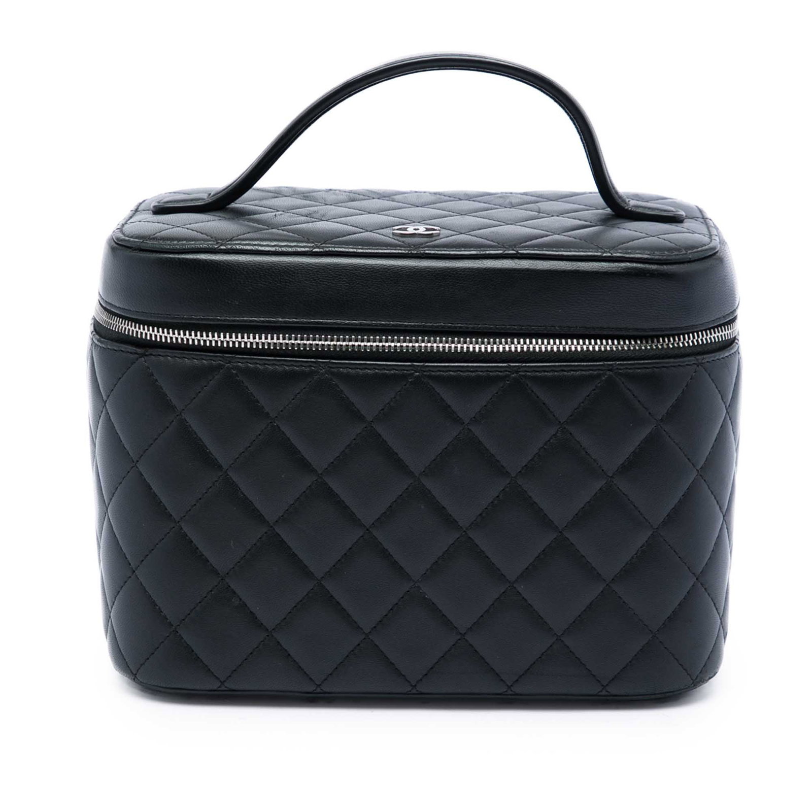 Chanel CC Quilted Vanity Bag in Black Lambskin: Chanel CC Quilted Vanity Bag in Black Lambskin Chanel CC Quilted Lambskin Vanity Bag in black leather with a quilted body, flat top handle, zip-around closure, and interior slip pockets. Made in Italy