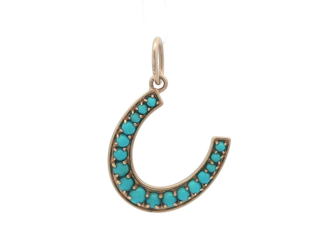 14k Yellow Gold Horseshoe Pendant with 17 Turquoise Stones: 14k Yellow Gold Horseshoe Pendant with 17 Turquoise Stones Pre-owned lucky horseshoe pendant in solid 14k yellow gold with a satin finish, accented by natural turquoise beads in a pave setting. This w