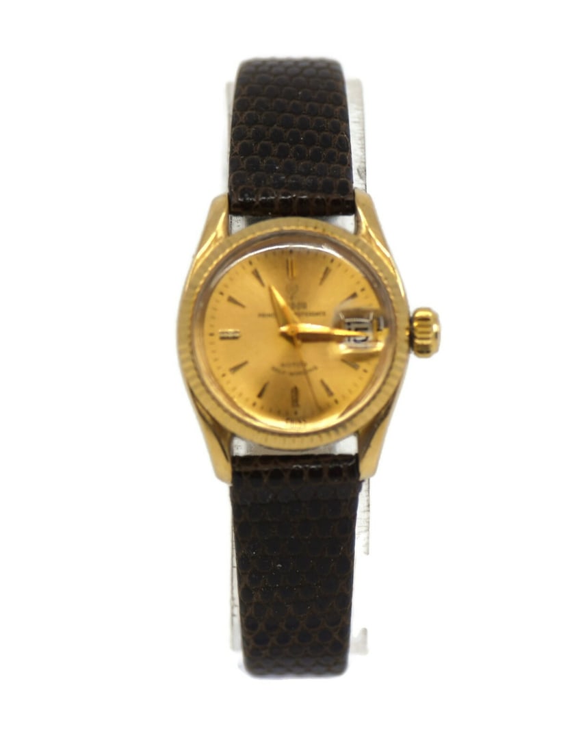 TUDOR Prince Oysterdate 24 mm 18K Yellow Gold Wristwatch: TUDOR Prince Oysterdate 24 mm 18K Yellow Gold Wristwatch Pre-owned Tudor Prince Oysterdate wristwatch with an automatic mechanical movement and a champagne dial. The watch features an 18K yellow gold 