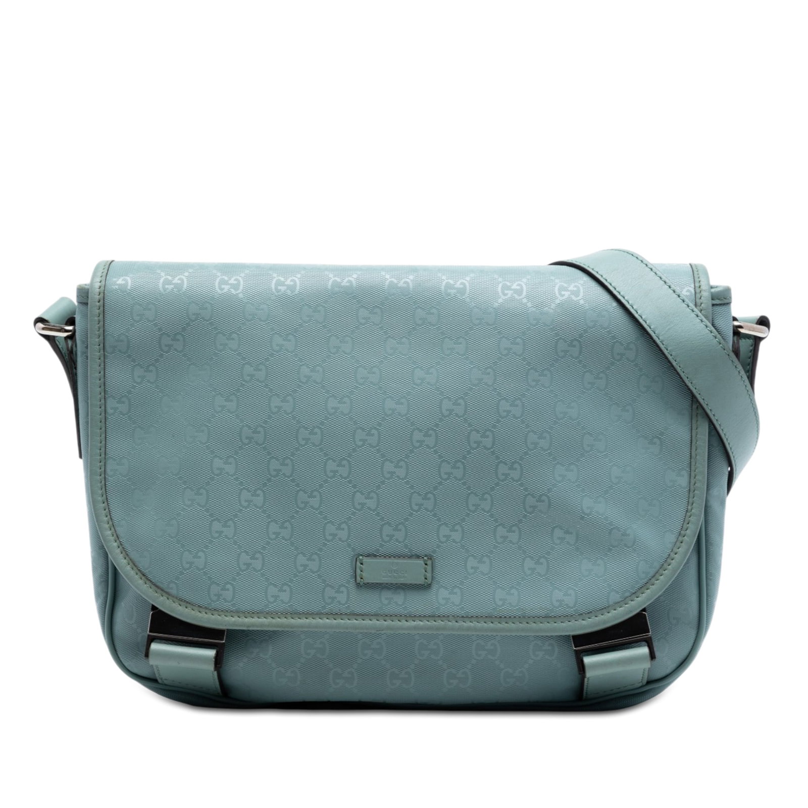 Gucci GG Imprime blue coated canvas crossbody bag: Gucci GG Imprime blue coated canvas crossbody bag Gucci GG Imprime crossbody bag in blue with a coated canvas body and leather trim. It features an adjustable flat canvas strap, a top flap with dual b