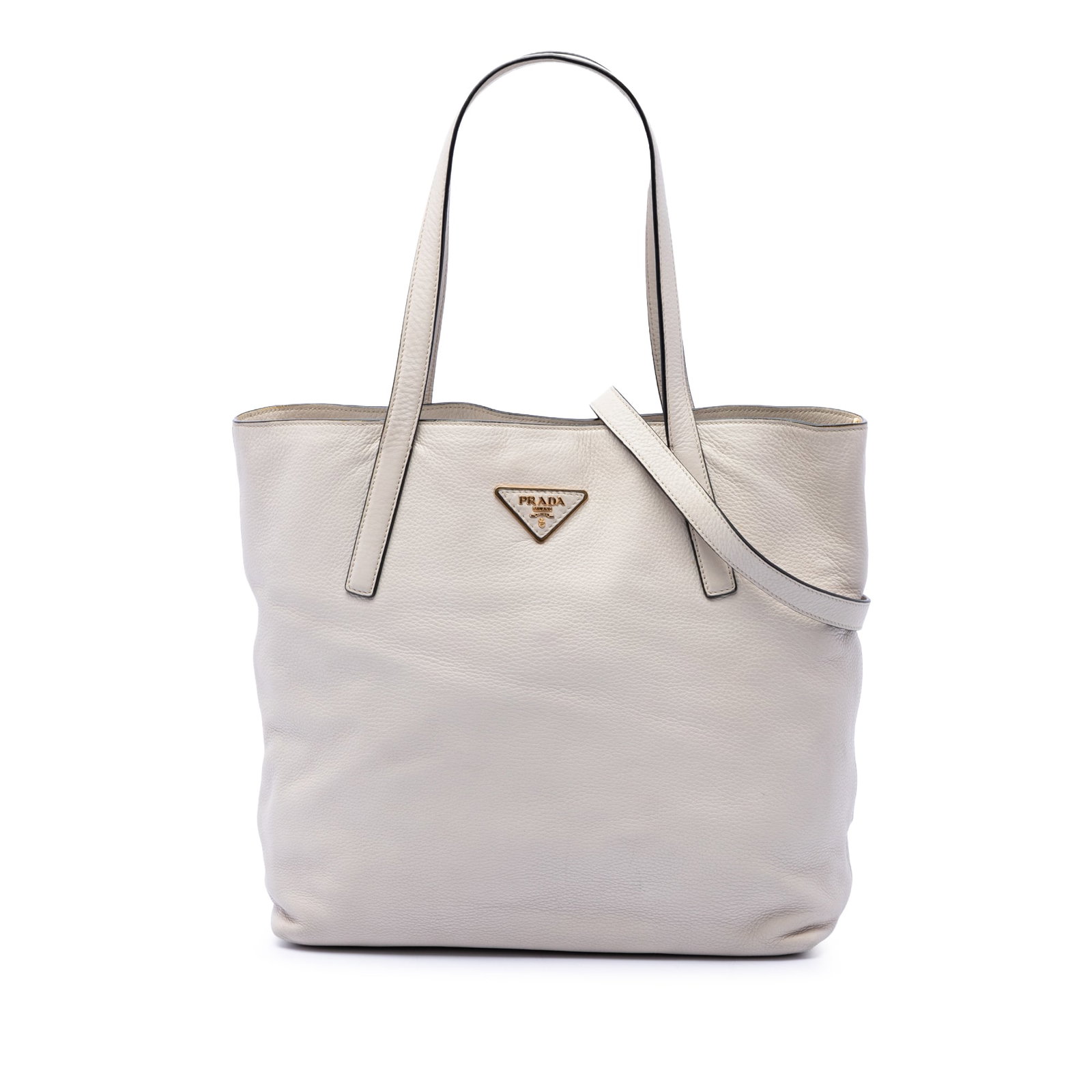 Prada Vitello Daino leather satchel tote with shoulder strap: Prada Vitello Daino leather satchel tote with shoulder strap A Prada Vitello Daino Open Convertible Tote in white leather with a structured satchel silhouette. It features flat leather handles, a deta