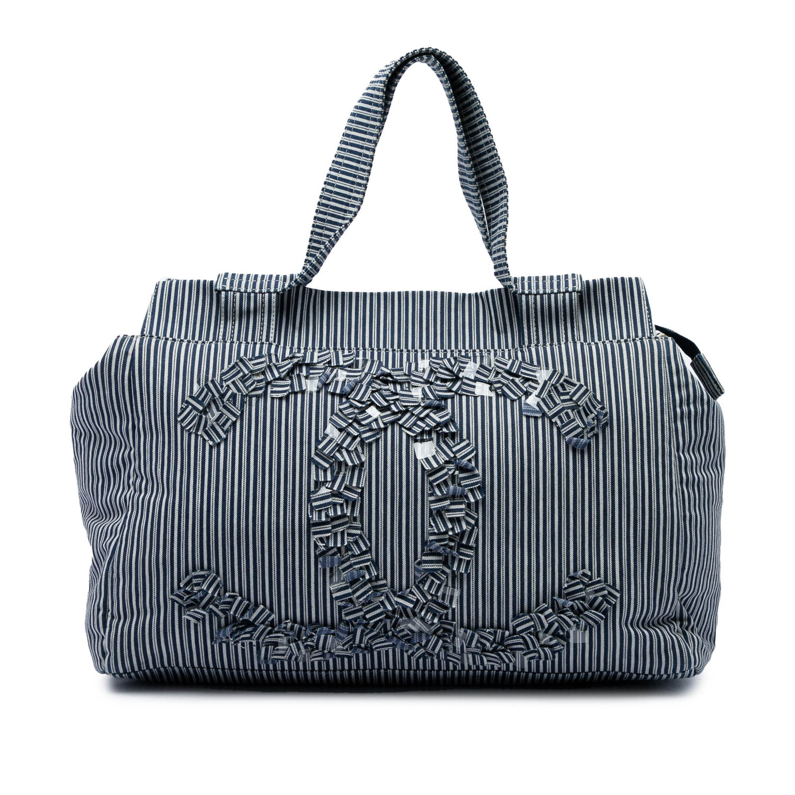 Chanel CC Shopper Tote in Blue Striped Canvas: Chanel CC Shopper Tote in Blue Striped Canvas A Chanel shopper tote crafted in striped canvas with the classic CC design. This tote features flat handles, a top zip closure, and an interior with zip a