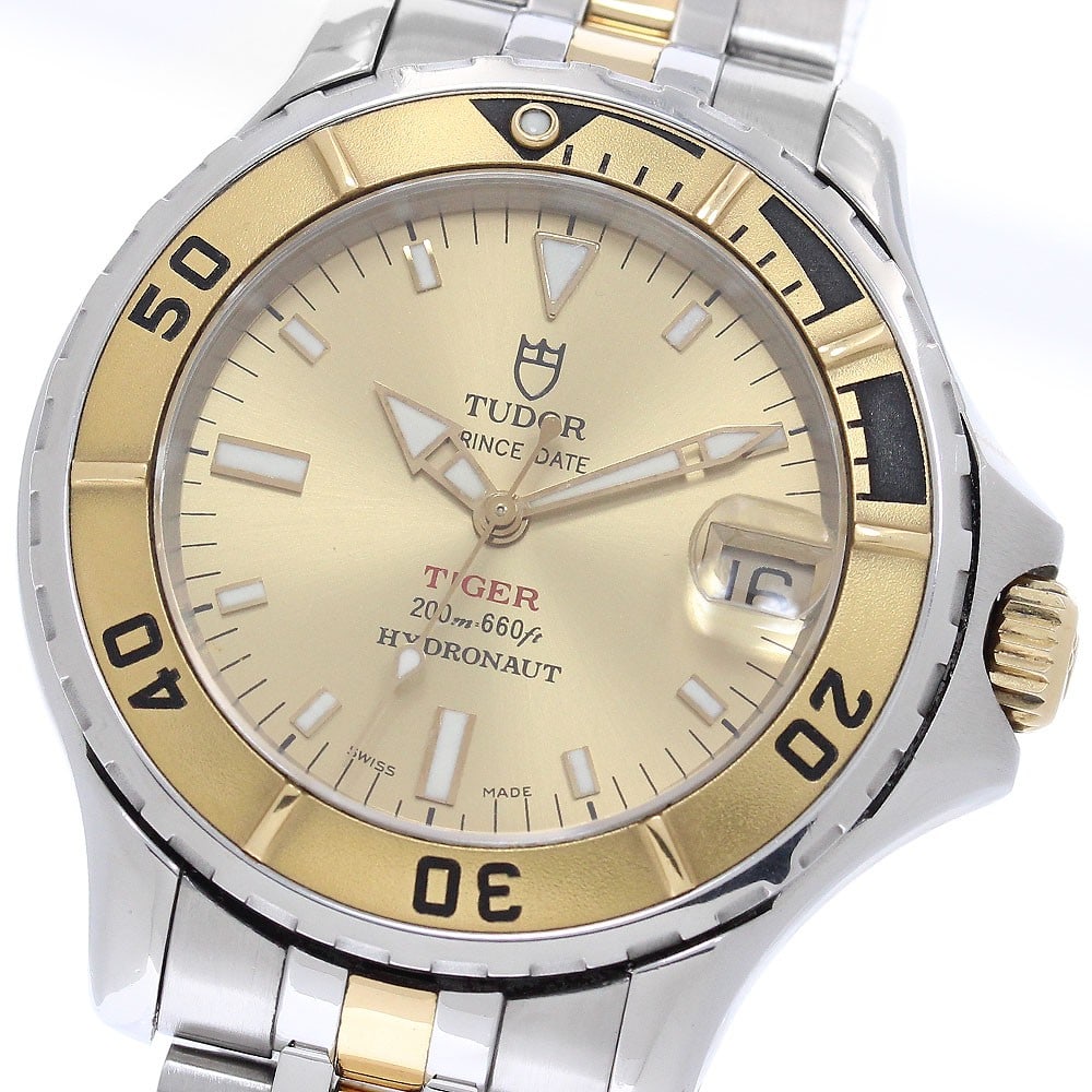 TUDOR Hydronaut Tiger Ref 85193 Automatic Date Unisex Wristwatch: TUDOR Hydronaut Tiger Ref 85193 Automatic Date Unisex Wristwatch TUDOR Hydronaut Tiger Date automatic wristwatch with a gold-tone dial and date display. This unisex watch shows visible signs of prior 