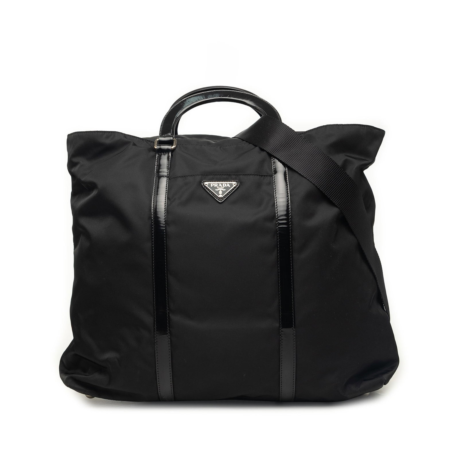 Prada Tessuto Convertible Tote Black Nylon Satchel: Prada Tessuto Convertible Tote Black Nylon Satchel Prada Tessuto Convertible Tote in black with a nylon body and leather trim. This satchel-style bag features flat leather handles, a detachable flat s