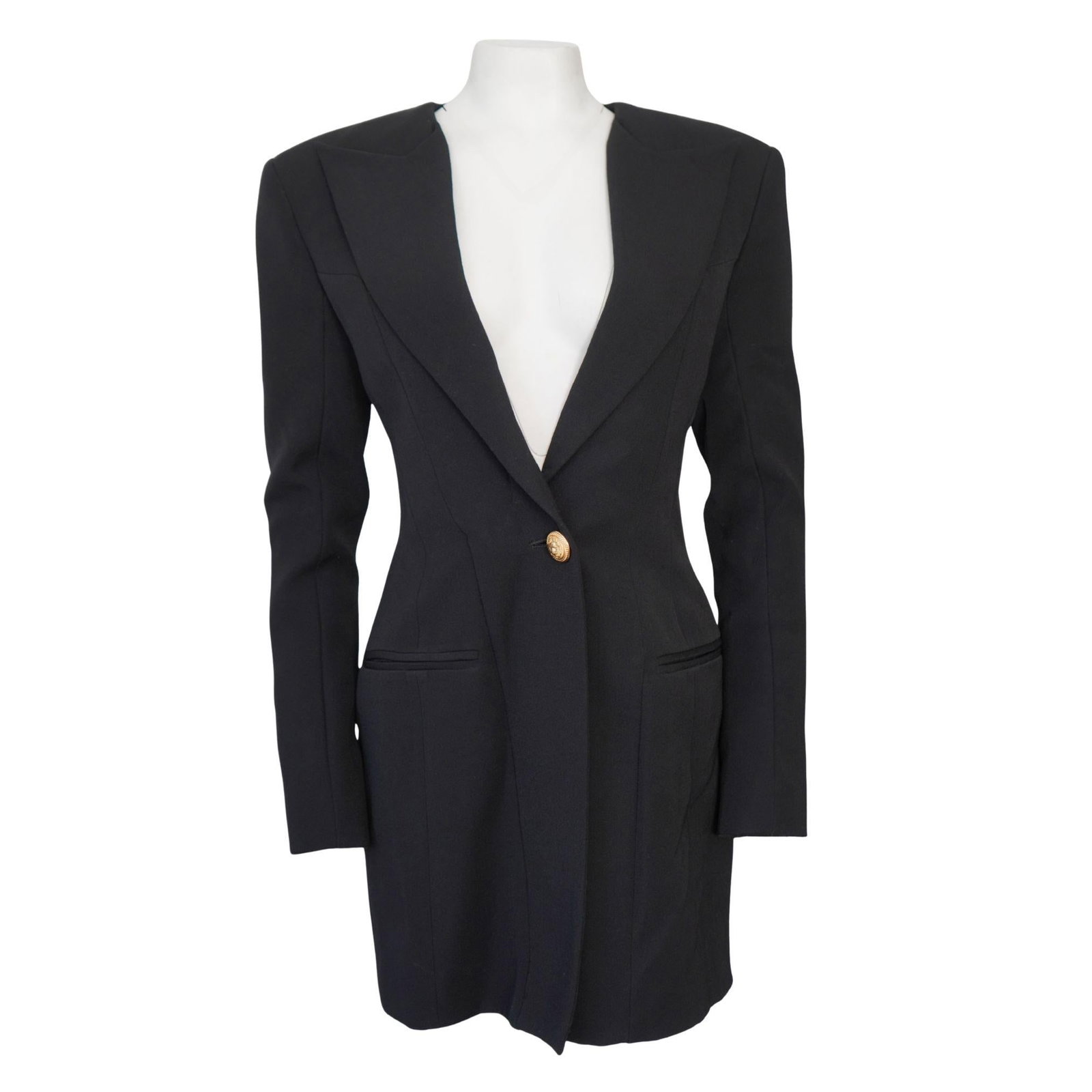 Balmain wool blazer dress black single button size 40: Balmain wool blazer dress black single button size 40 Black wool single-breasted blazer mini dress with padded shoulders, a back zip closure, faux front button, and button sleeve details. Marked size 