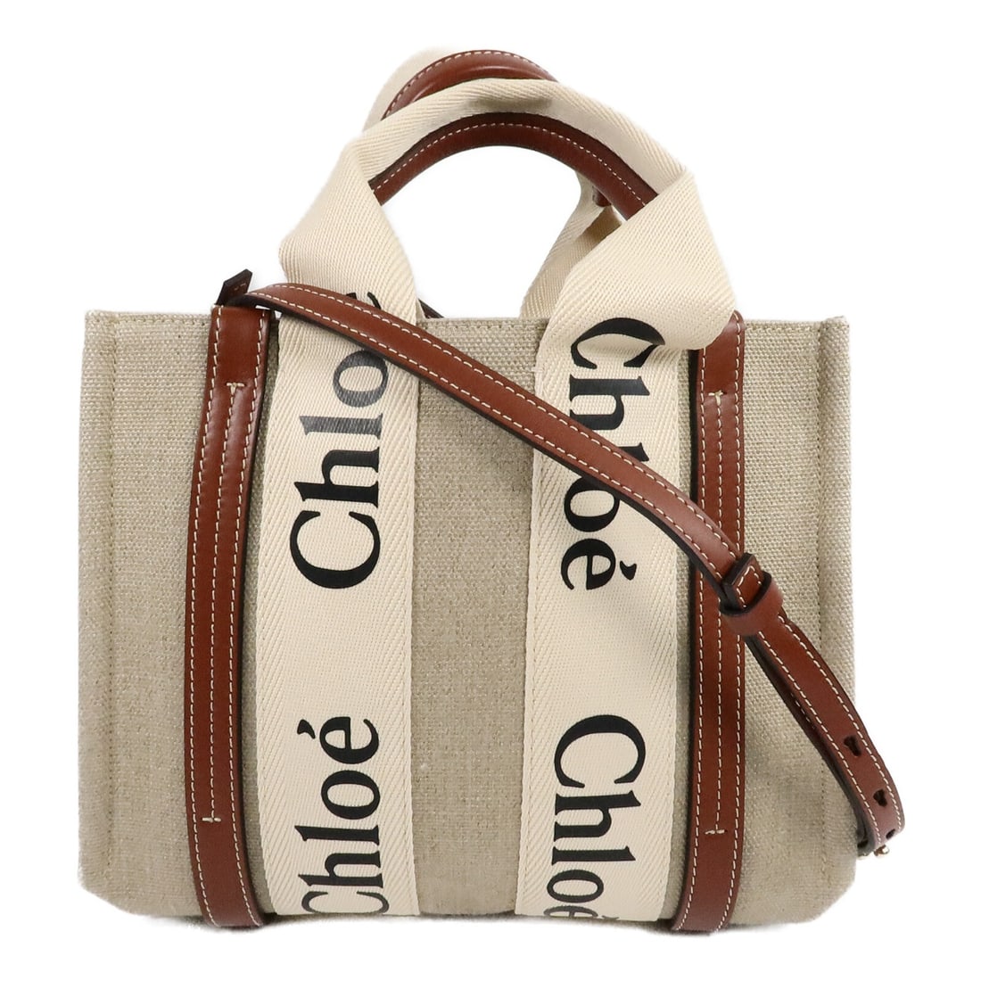 Chloe Woody Small Canvas 2way Shoulder Bag Brown GHW: Chloe Woody Small Canvas 2way Shoulder Bag Brown GHW Small Chloe Woody 2-way shoulder bag in brown canvas with top handles and a detachable shoulder strap. The interior includes one open pocket, and t