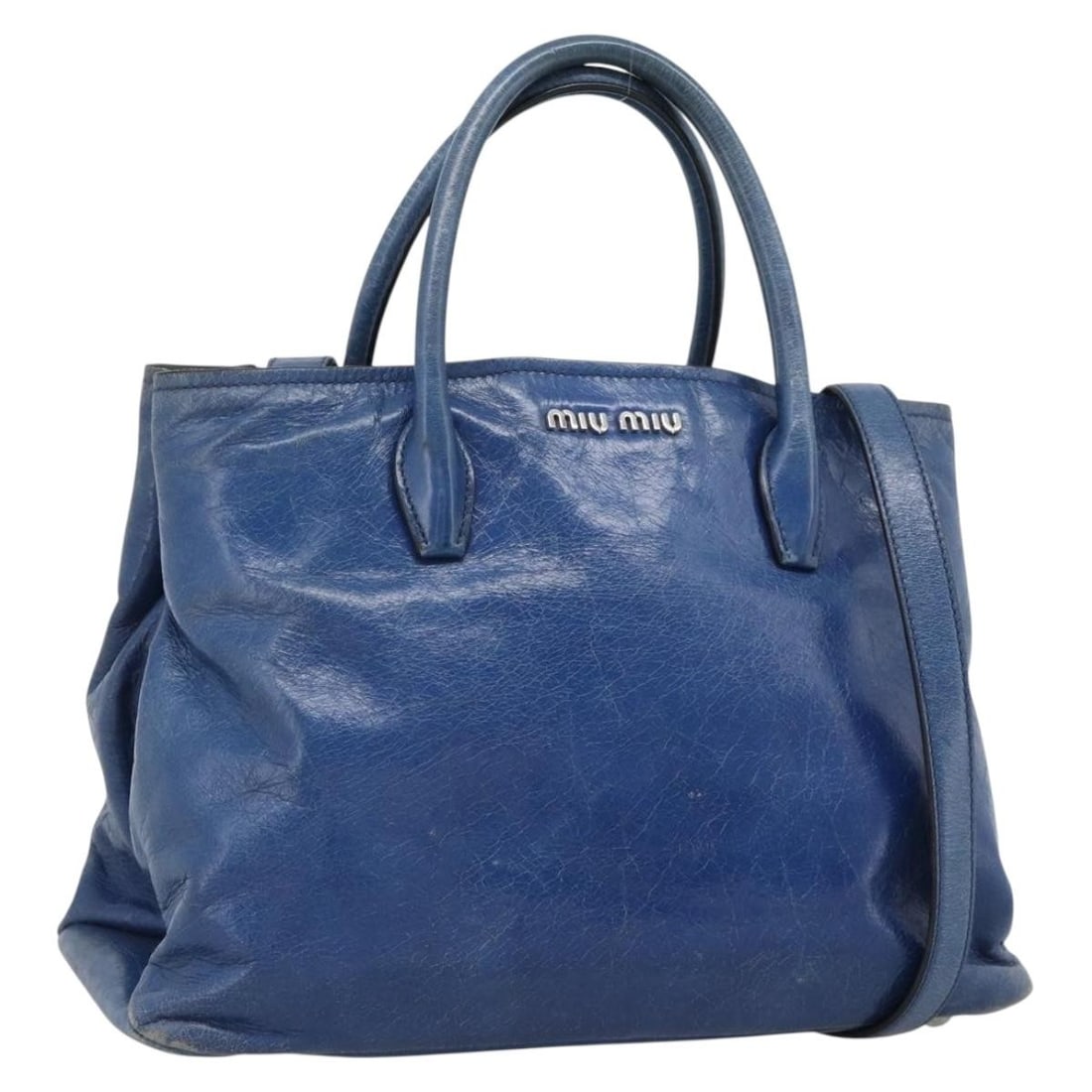 Miu Miu Blue Leather 2 Way Handbag with Strap and Dust Bag: Miu Miu Blue Leather 2 Way Handbag with Strap and Dust Bag Miu Miu 2-way handbag in blue leather with silver-tone accents. This women's bag includes a top handle and a detachable shoulder strap, along