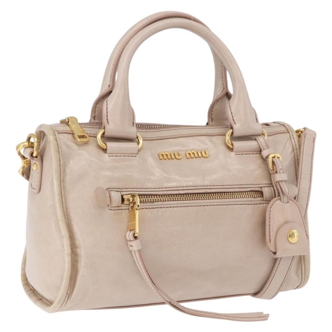 Miu Miu Leather 2way Hand Bag Beige with Gold Tone: Miu Miu Leather 2way Hand Bag Beige with Gold Tone Miu Miu 2-way handbag in beige leather with gold-tone accents. Designed for women and made in Italy, this bag includes a clochette and shoulder strap