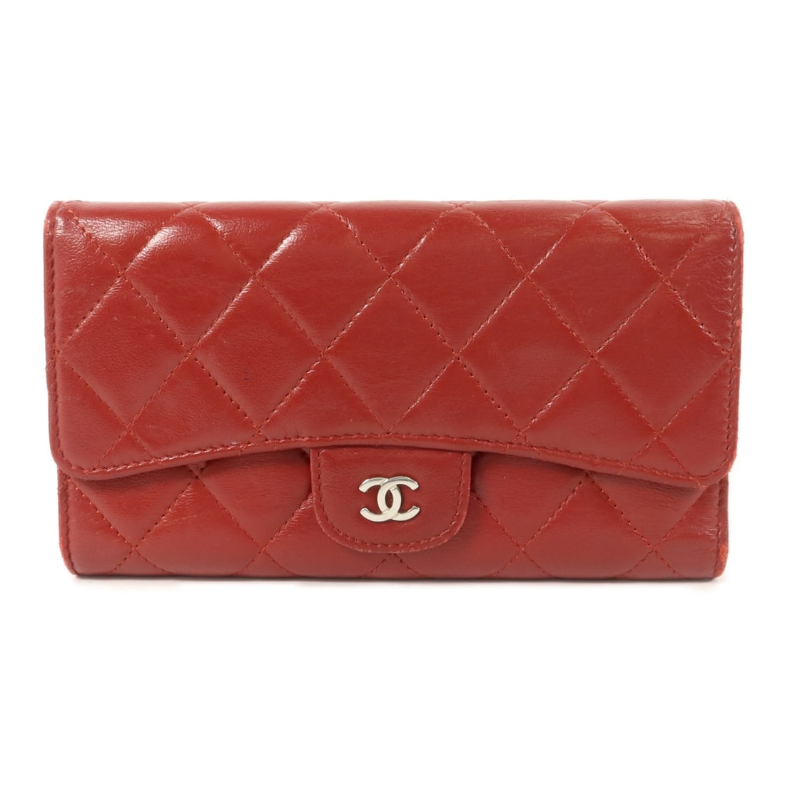 CHANEL A31506 tri fold long wallet red calfskin CC SHW: CHANEL A31506 tri fold long wallet red calfskin CC SHW Chanel tri-fold long wallet in red calfskin leather with CC hardware. This women's wallet features a hook button closure and an organized interio