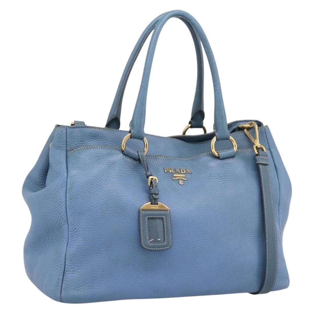 PRADA leather 2way tote bag blue with name tag: PRADA leather 2way tote bag blue with name tag Prada 2-way tote bag in blue leather with gold-tone accents. This women's bag includes a name tag and has been customized with repainting; the exterior h