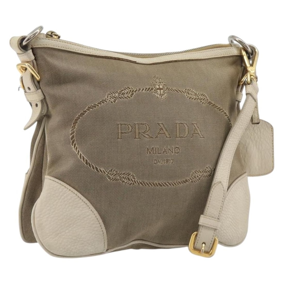 PRADA Canvas Shoulder Bag Beige Gold with Name Tag Card: PRADA Canvas Shoulder Bag Beige Gold with Name Tag Card Authentic Prada shoulder bag in beige and gold canvas with an adjustable shoulder strap. Includes the name tag and guarantee card. This heavily 
