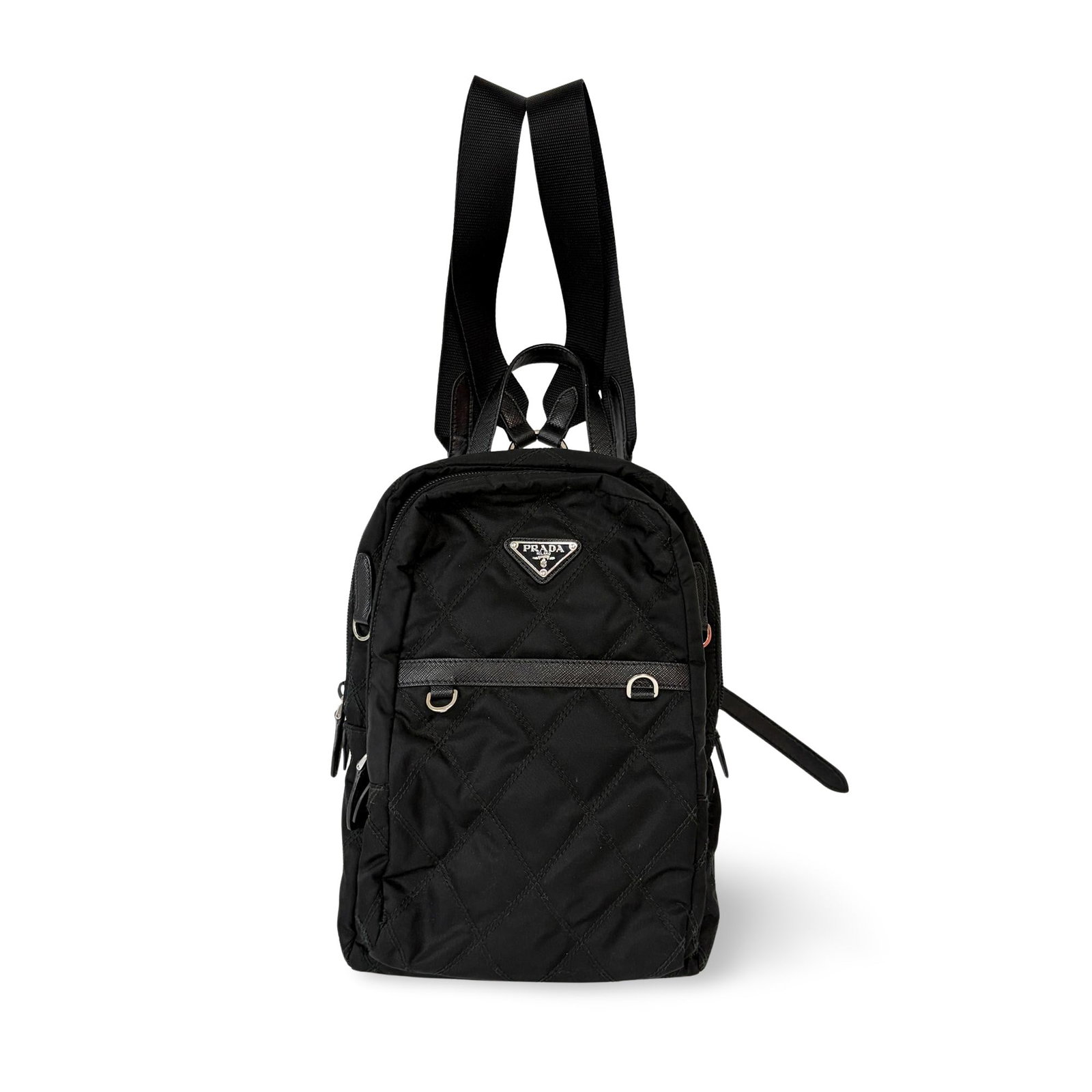 Prada Zip Sling Black Re-Nylon Bag: Prada Zip Sling Black Re-Nylon Bag Prada Zip Sling Re-Nylon in black with leather trim. Made in Italy, this women's bag is in very good condition with some small stains on the exterior and interior. T