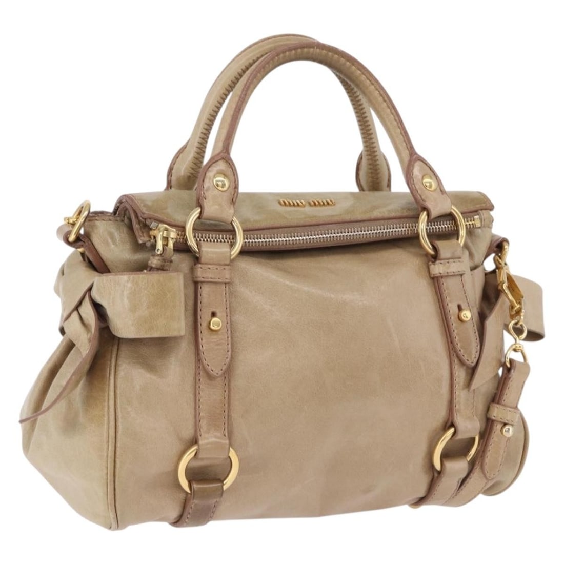 Miu Miu Beige Leather 2way Handbag with Shoulder Strap: Miu Miu Beige Leather 2way Handbag with Shoulder Strap Miu Miu 2-way handbag in beige leather with gold-tone accents. This women's bag includes a shoulder strap and can be carried by hand or worn over