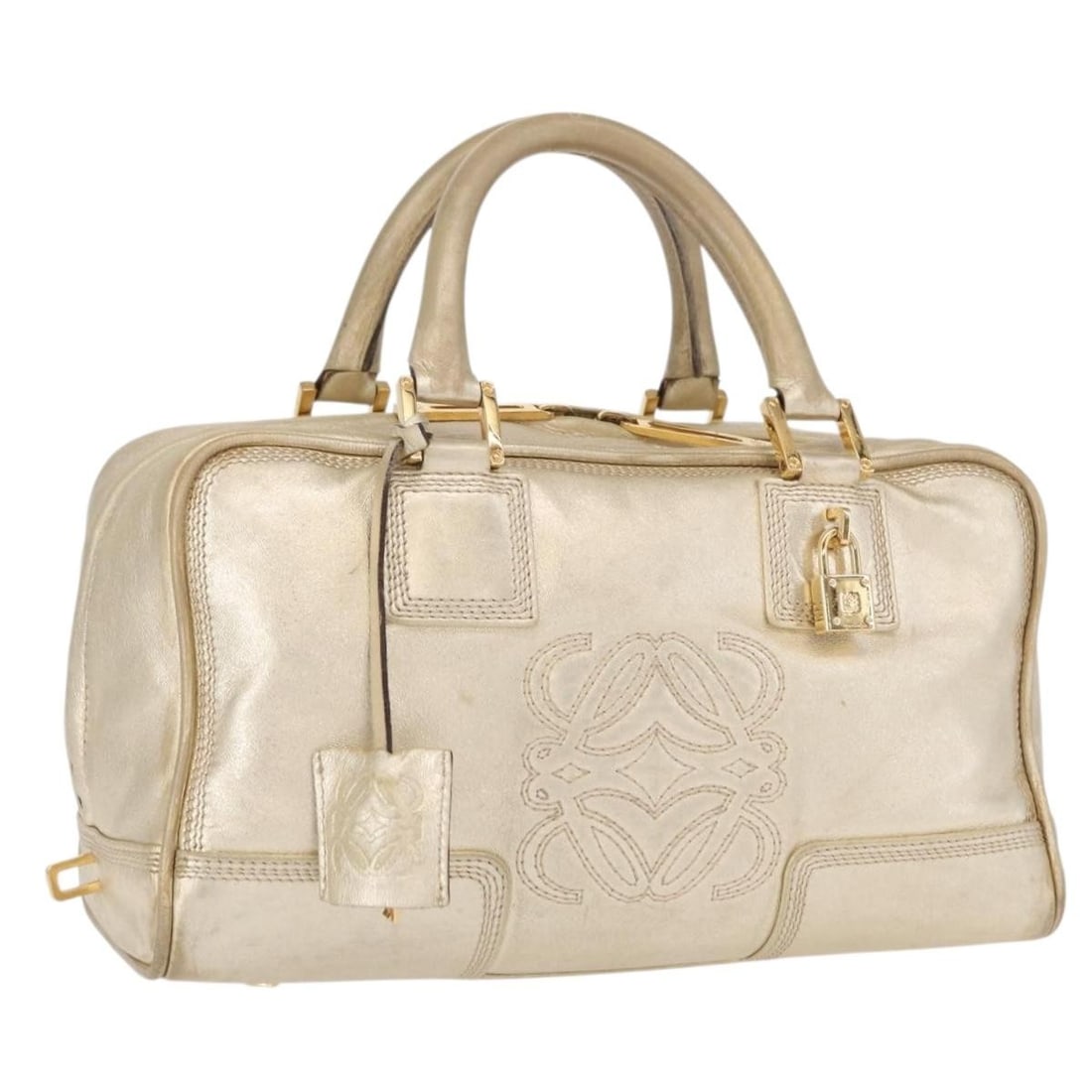 LOEWE Anagram Americana Leather Handbag Gold Tone with Padlock Key Clochette: LOEWE Anagram Americana Leather Handbag Gold Tone with Padlock Key Clochette LOEWE Anagram Americana 28 handbag crafted in leather with a gold tone exterior. This women's handbag is made in Spain and 