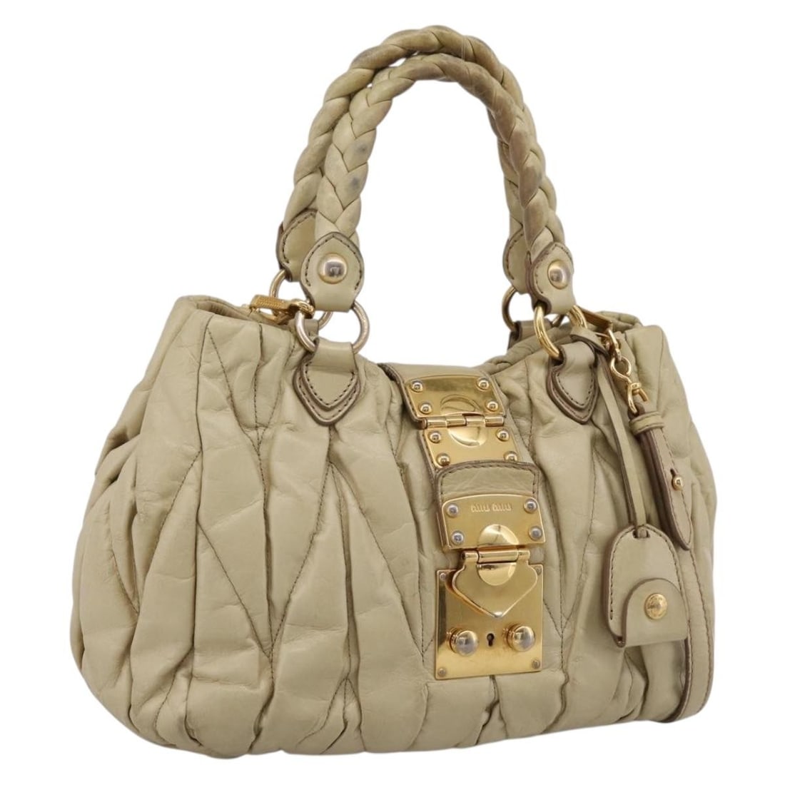 Miu Miu Beige Leather 2way Handbag with Strap and Dust Bag: Miu Miu Beige Leather 2way Handbag with Strap and Dust Bag Miu Miu 2-way handbag in beige leather with gold-tone accents. Designed for women, this bag includes a top handle and a removable shoulder st