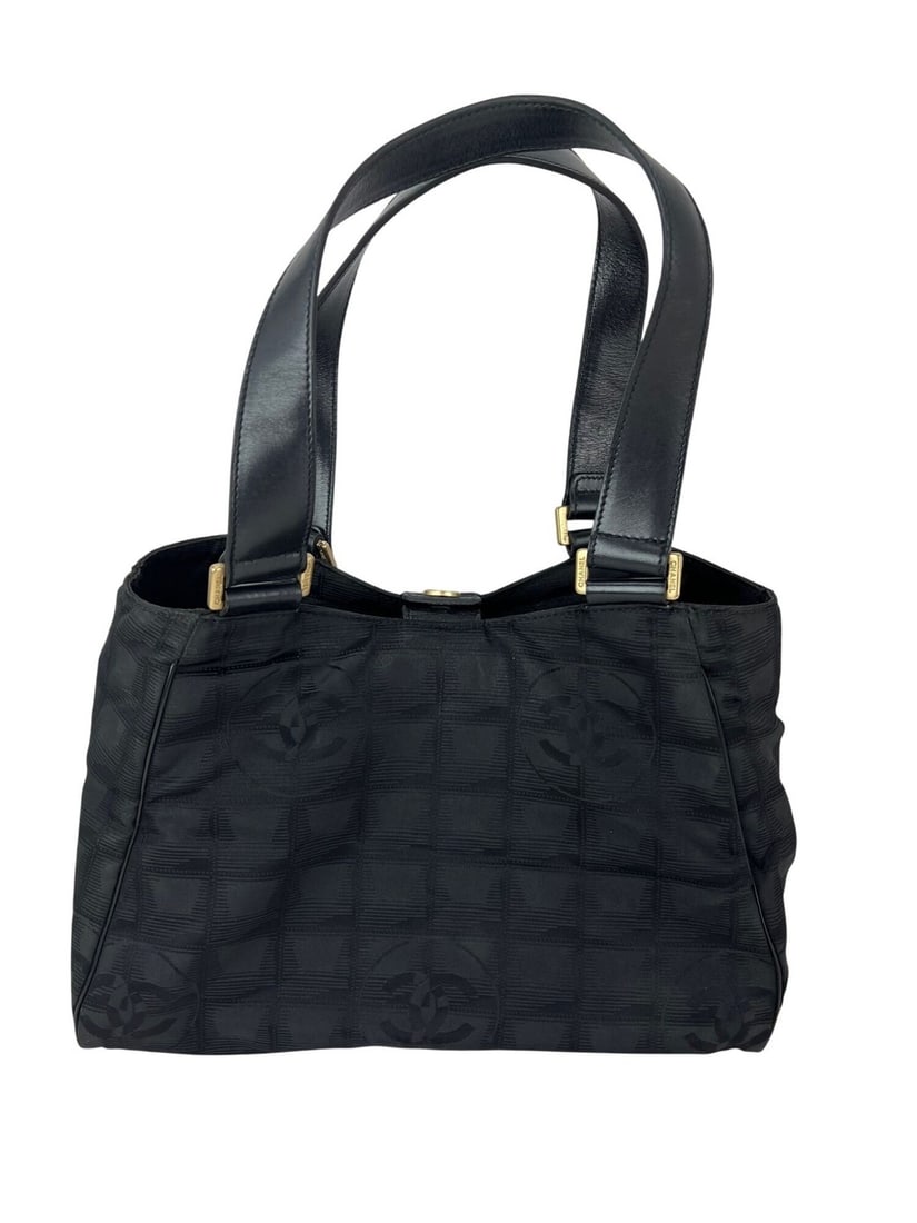 Chanel Travel Line Small Black Nylon Tote Bag: Chanel Travel Line Small Black Nylon Tote Bag Vintage Chanel Travel Line tote bag in black nylon with a rectangular silhouette and matte finish. Designed with double leather handles, a snap closure, b