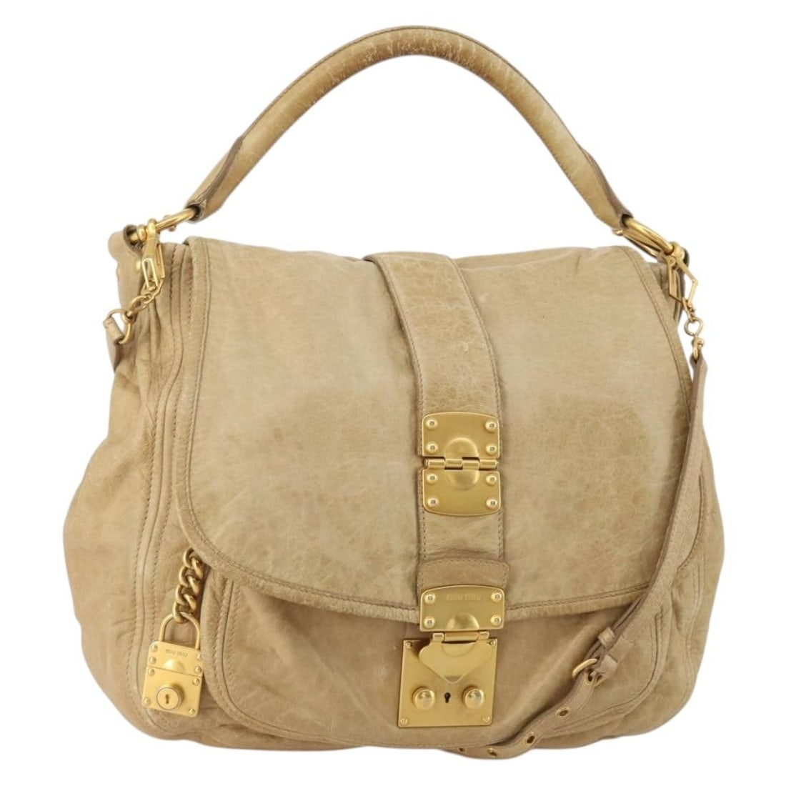 Miu Miu Beige Leather 2way Shoulder Bag with Strap Charm: Miu Miu Beige Leather 2way Shoulder Bag with Strap Charm Miu Miu 2-way shoulder bag in beige leather with gold-tone accents. This women's bag includes a shoulder strap and charm. Condition is heavily 