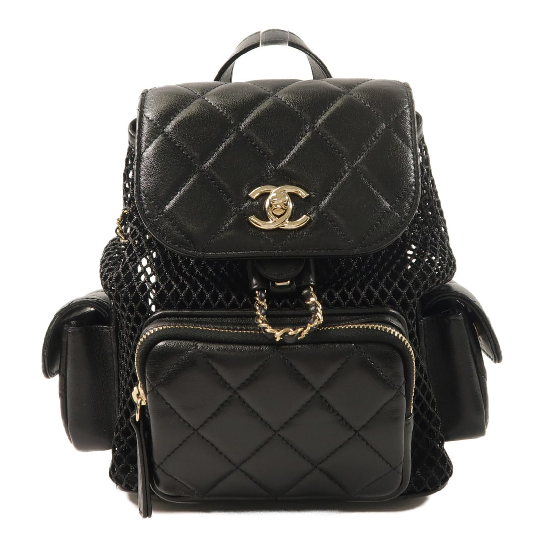 CHANEL AS5484 Black Lambskin Mesh Rucksack Backpack: CHANEL AS5484 Black Lambskin Mesh Rucksack Backpack A black rucksack backpack in lambskin (sheep leather) with mesh details. It features a turn lock closure, outside magnetic pockets, and an inside zi