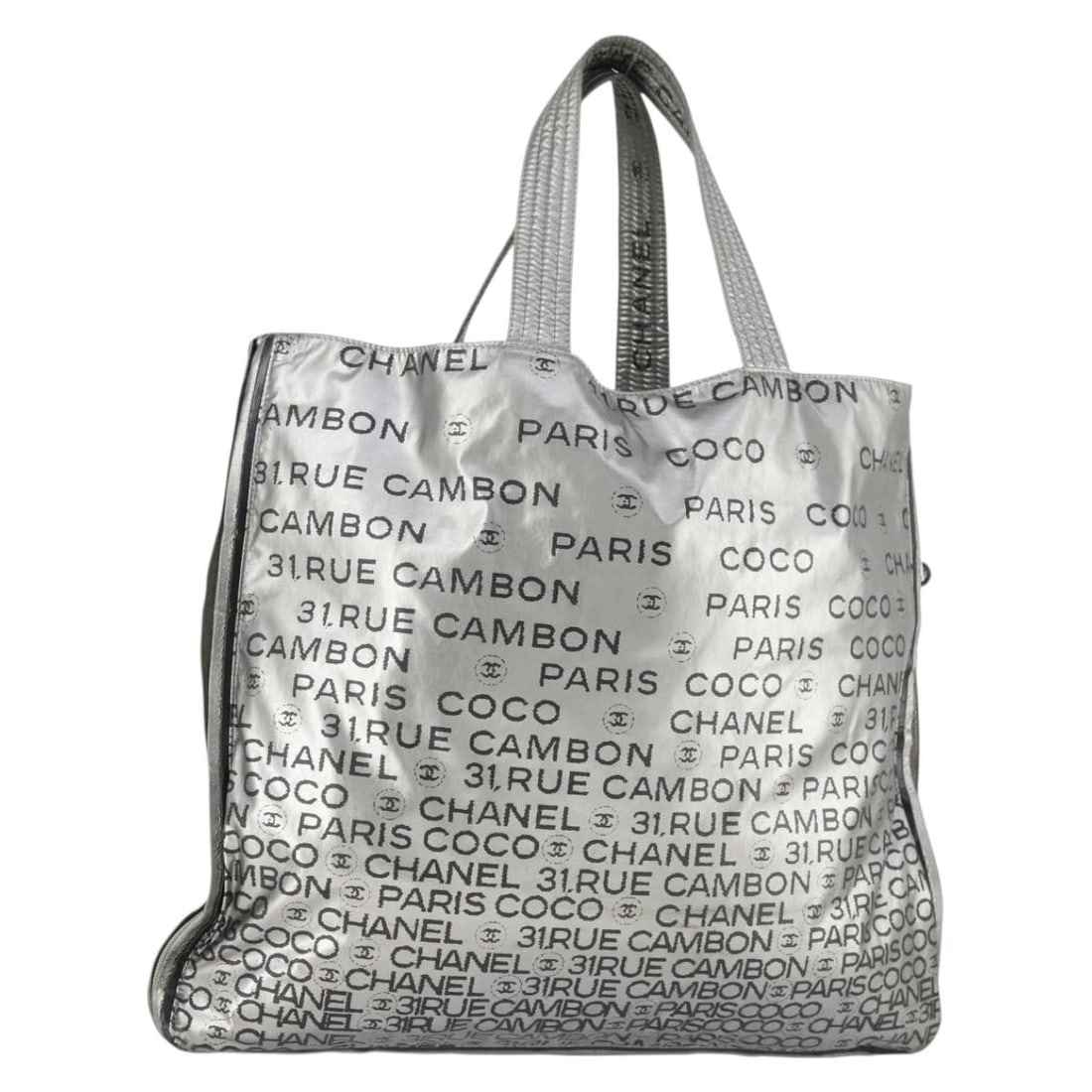 Silver Nylon Chanel Tote Bag Made in Italy BS32854: Silver Nylon Chanel Tote Bag Made in Italy BS32854 This Chanel Unlimited Tote Bag features a silver nylon exterior and a spacious design ideal for everyday use. Crafted in Italy, the tote includes sil