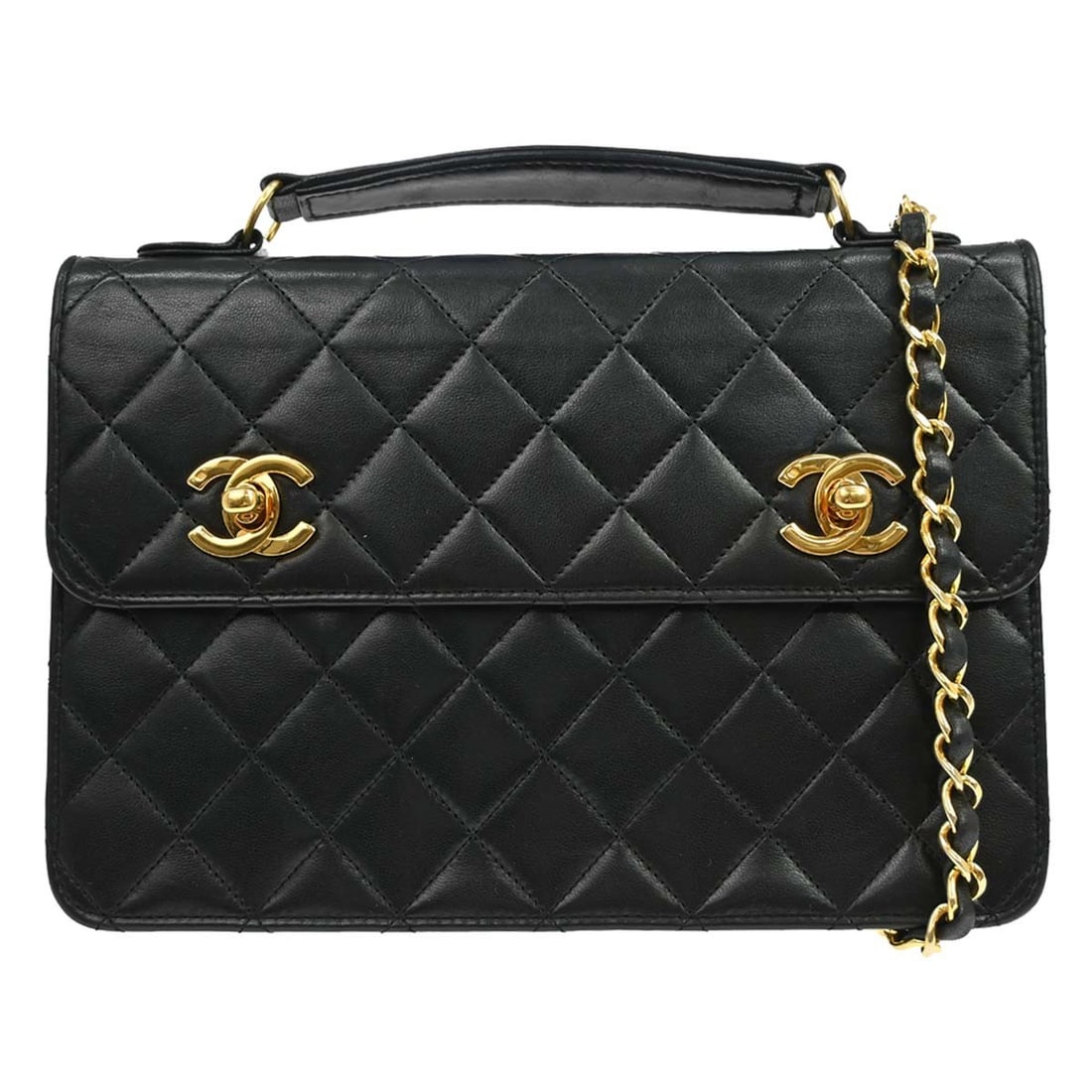 CHANEL CC medium black lambskin top handle bag with strap: CHANEL CC medium black lambskin top handle bag with strap Chanel black lambskin 2-way handbag with a double turnlock design and top handle styling. This medium bag features a leather lining, logo acce