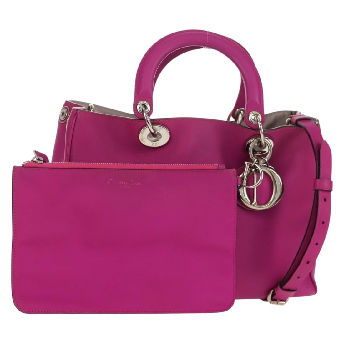 Christian Dior Diorissimo leather 2way handbag purple with strap pouch charm: Christian Dior Diorissimo leather 2way handbag purple with strap pouch charm Christian Dior Diorissimo 2-way handbag in purple leather with silver-tone accents. This women's bag includes a shoulder st