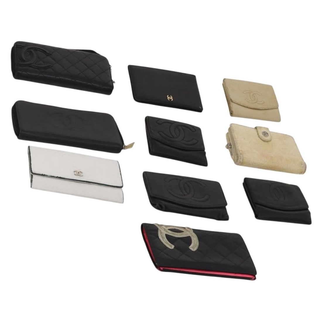 Set of 10 CHANEL leather wallets in white beige black: Set of 10 CHANEL leather wallets in white beige black Set of 10 Chanel leather wallets in white, beige, and black. Includes a guarantee card. These wallets show heavy overall wear, with notable condit