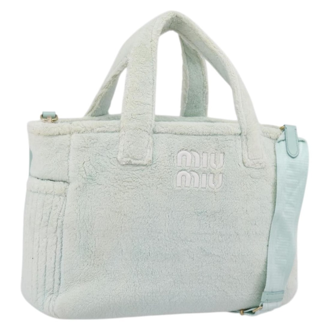 Miu Miu 2way Pile Handbag Light Blue with Gold Tone Strap: Miu Miu 2way Pile Handbag Light Blue with Gold Tone Strap Miu Miu 2-way handbag in light blue pile with gold-tone accents. Made in Italy, this women's bag includes a shoulder strap for hand or shoulde