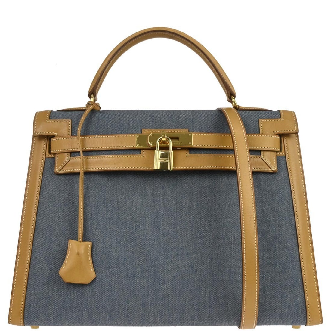 Hermes Kelly 32 Sellier Blue Denim and Vache Top Handle Bag: Hermes Kelly 32 Sellier Blue Denim and Vache Top Handle Bag Hermes Kelly 32 Sellier 2-way handbag in blue and natural Toile Jean and Vache leather. This structured top handle design features a turn-lo