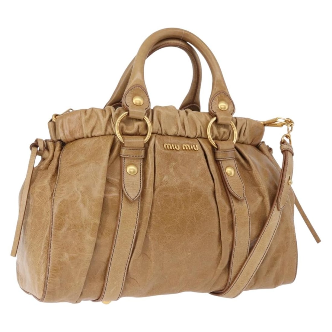 Miu Miu 2way Leather Handbag Beige Gold with Shoulder Strap: Miu Miu 2way Leather Handbag Beige Gold with Shoulder Strap Miu Miu Vitellolux 2-way handbag in beige leather with gold-tone accents. Made in Italy, this women's handbag includes a shoulder strap for 
