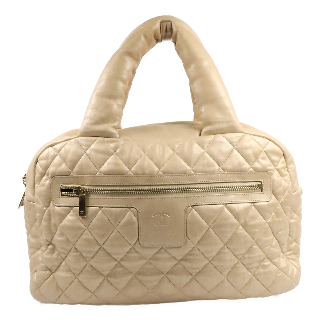 CHANEL Coco Cocoon Lambskin Tote Bag Gold CC GHW: CHANEL Coco Cocoon Lambskin Tote Bag Gold CC GHW CHANEL Coco Cocoon tote bag in gold lambskin leather with CC detailing and gold-tone hardware. Made in France, this women's tote features a spacious si