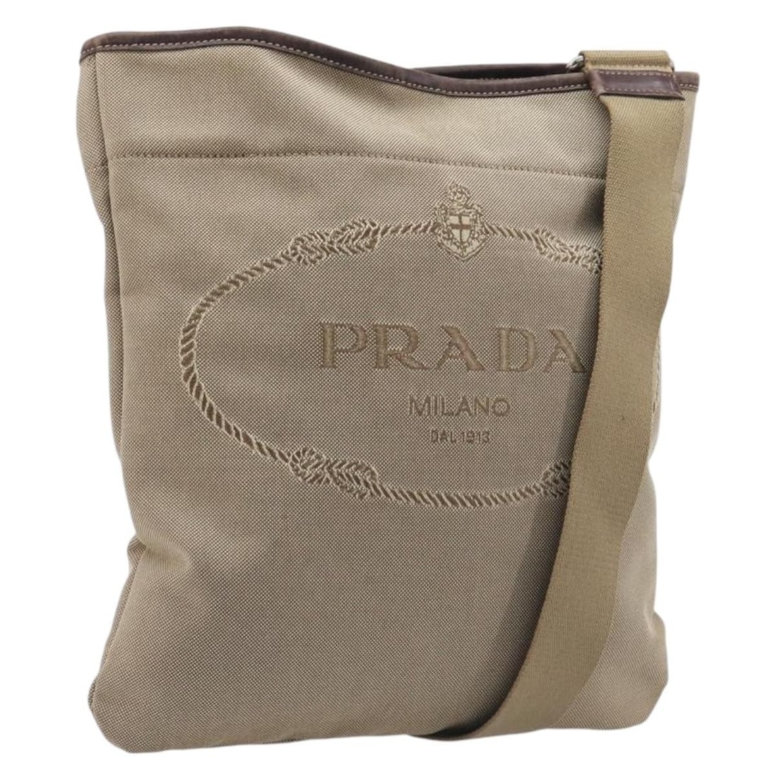PRADA Canvas Shoulder Bag in Silver Beige Jacquard: PRADA Canvas Shoulder Bag in Silver Beige Jacquard Authentic Prada jacquard shoulder bag in silver and beige canvas. This women's bag is made in Italy and features an adjustable shoulder strap. Includ