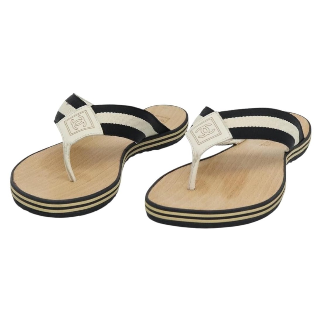 CHANEL Coco Mark Beige Wood Beach Sandals with Box: CHANEL Coco Mark Beige Wood Beach Sandals with Box Authentic CHANEL Coco Mark beach sandals in beige wood. This women's sandal pair comes with the item box. Condition is heavily used, with slight rubb