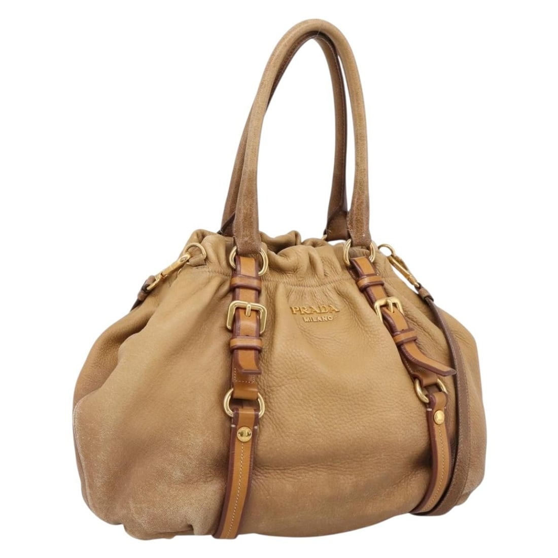 PRADA Beige Leather 2 Way Handbag with Strap and Name Tag: PRADA Beige Leather 2 Way Handbag with Strap and Name Tag Prada 2-way handbag in beige leather with gold-tone accents. Made in Italy, this women's bag includes a name tag, shoulder strap, and guarante