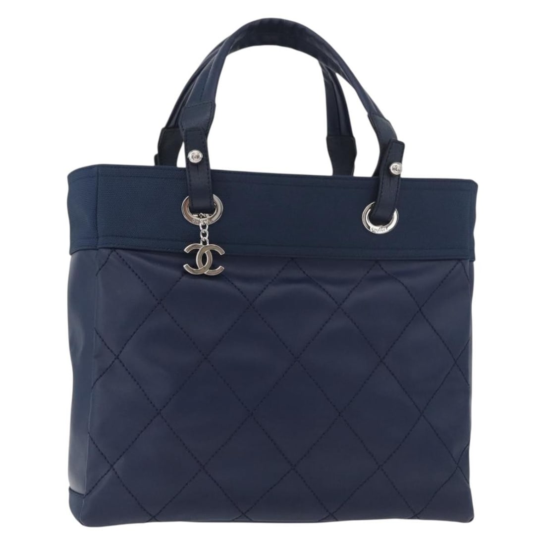 CHANEL Paris Biarritz MM Navy Coated Canvas Tote with Dust Bag: CHANEL Paris Biarritz MM Navy Coated Canvas Tote with Dust Bag Authentic CHANEL Paris Biarritz MM tote bag in navy and silver coated canvas. This women's tote is made in Italy and includes a dust bag,
