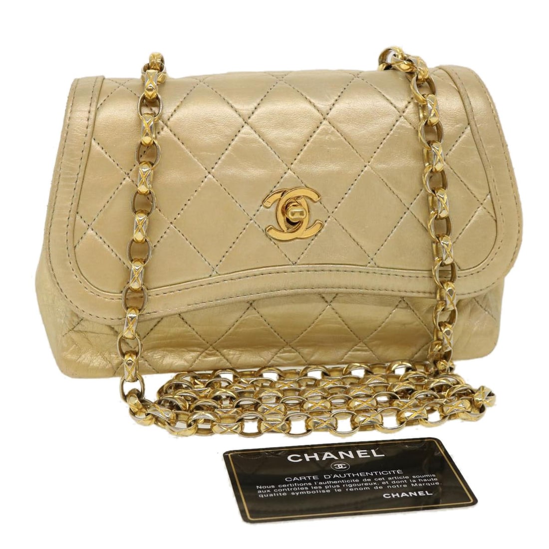 CHANEL CC Turn Lock Matelasse Lamb Skin Shoulder Bag Gold: CHANEL CC Turn Lock Matelasse Lamb Skin Shoulder Bag Gold Matelasse turn lock chain shoulder bag in gold lamb skin. This women's shoulder bag was made in France and features a classic chain strap. Ple