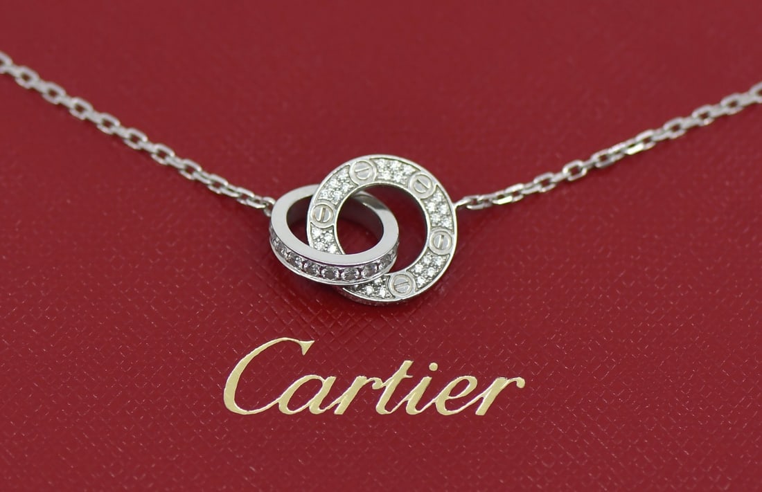 Cartier Love Necklace 18K White Gold Diamond 16 Inches: Cartier Love Necklace 18K White Gold Diamond 16 Inches Cartier Love necklace in 18k white gold with diamond accents. This chain-style necklace is pre-owned and made in France. It is offered with box a