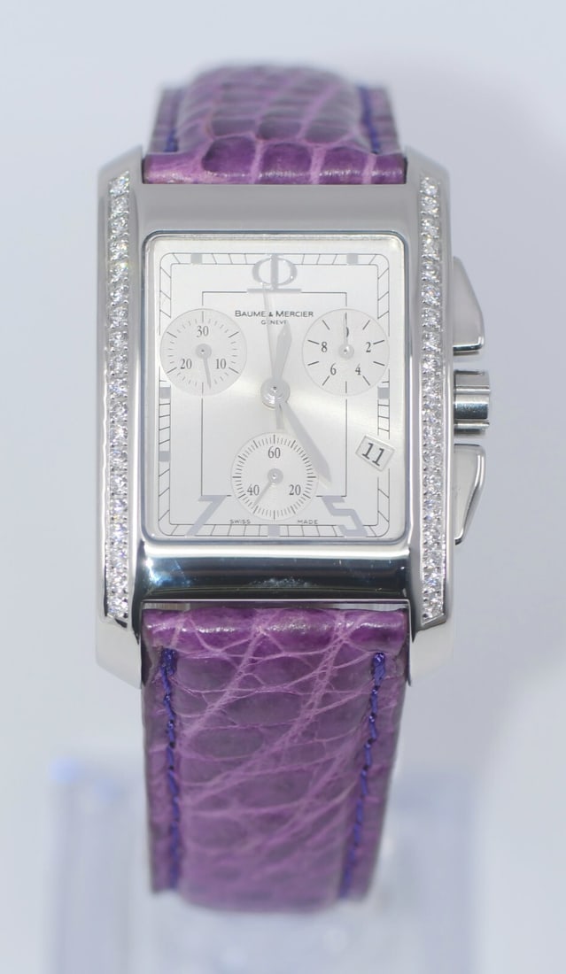 Baume & Mercier Hampton Ref 65428 Quartz Wristwatch Diamond Bezel Steel Case: Baume & Mercier Hampton Ref 65428 Quartz Wristwatch Diamond Bezel Steel Case Baume & Mercier Hampton wristwatch with a stainless steel case, silver analog dial, and purple leather strap. This unisex q